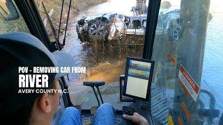 POV - pulling a car out of the river in N.C. after the Hurricane