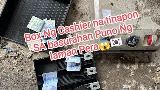 Box ng Cashier na tinapon sa basurahan, puno ng laman na pera 