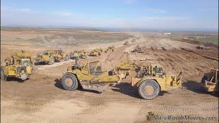 Digging new landfill cell with fleet of Caterpillar scrapers (Part 1)