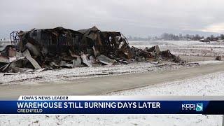 Fire at Greenfield trucking company continues to smolder