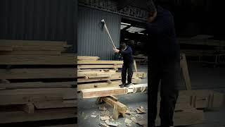 Splitting a tree with an axe while standing