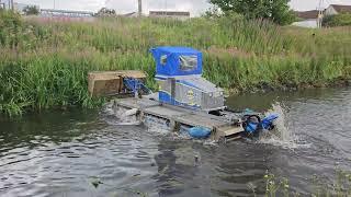 Cleaning the banks of the Union Canal, Scotland