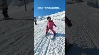 2 year old Adia loves to ski!  And a proud dad captures those precious, adorable moments.#neve