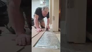 how to install 7 mm laminate floor under a door jamb.