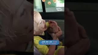 Little Girl Uses Her Foot to Take out Chocolate From Door Console of Car