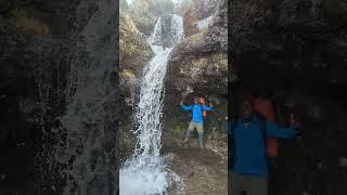 My guide standing behind the Waterfall | Shira Camp | Mount Kilimanjaro | The Roof of Africa | Day 2