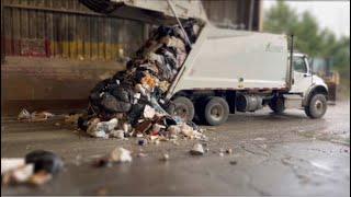 "Unbelievable! Garbage Truck So Loaded - Literally Plops a Brick!"