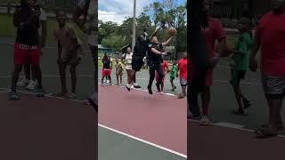 Sarasota Police Officer Grahling plays basketball with students in North Sarasota