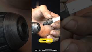 Attach the used spark plug to a power drill
