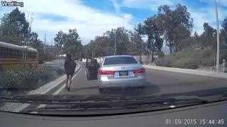 Watch The Bizarre Moment a Woman Walks Out of Her Moving Car