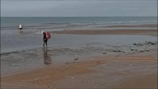 Walking on a beach in Islantilla, ocean waves, Huelva, Spain;