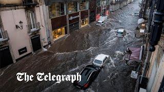 ‘It’s chaos’: restaurant owner films floods tearing through Sicily