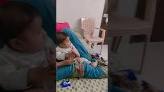 baby watching TV with grandmother