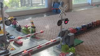 My railroad crossing gate toy close-up - James with many Thomas minis power move