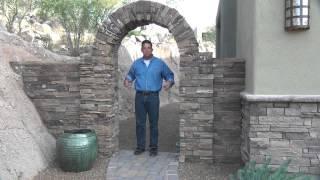 Affordable Fence and Gates describing whats needed to mount a gate on a wall with faux rock veneer