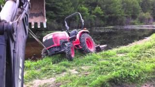 Stuck the Tractor.... Again...!  Backhoe to the Rescue..