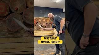 World champion knife thrower throwing fast draw at moving target!