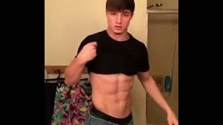 Teen muscle Josh flexing with his shirt on  and revealing his hard, well defined abs