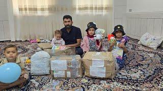 gift of happiness to nomadic family with arrival of the donated packages in the hands of engineer