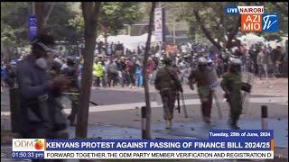 OVERWHELMED Riot Police officers run away from a charged GenZ crowd as they draw close to Parliament