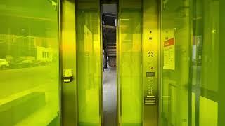 Neon Yellow Unknown Full-Glass Hydraulic Elevator at High Line in New York City, NY.