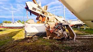 Patapsco River Waterway Cleanup of Dumped Boats. Unwanted boats removed and placed in dumpsters.