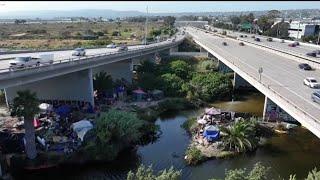 Drone video captures large homeless encampment under I-5 near SeaWorld Drive | NBC 7 San Diego