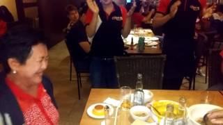 Waitstaff singing happy birthday