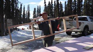 Installing the first cabinets and kitchen counter in the Alaska cabin