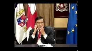 Georgian President Mikheil Saakashvili eats his tie