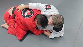 Jean Jacques Machado Rolling with (bigger) Black Belt Student