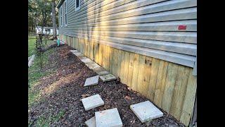 Mobile home skirting using treated lumber