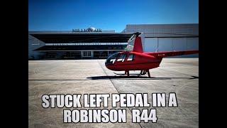 How to deal with a stuck left pedal in a Robinson R44 Helicopter