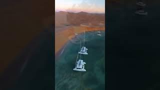 a solar-catamaran with floating lounge pods