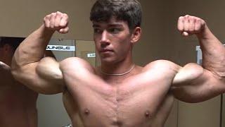 Handsome muscular guy showing off his muscle