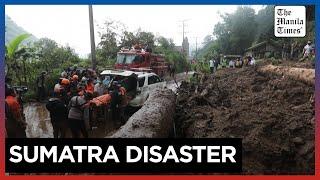 Indonesia digs out as flooding, landslide death toll hits 20