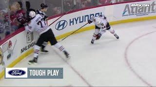 Jack Hughes scores a goal against the Chicago Blackhawks