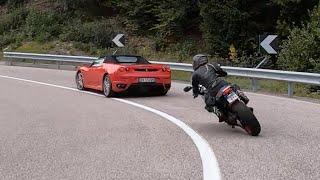 Ducati girl with pigtails chasing Ferrari on SS42 up to passo della Mendola