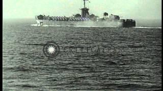 U.S. warships firing and underway during invasion of  Okinawa in World War II HD Stock Footage