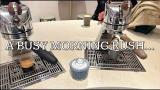 POV- Barista deals with a wave of morning coffees...