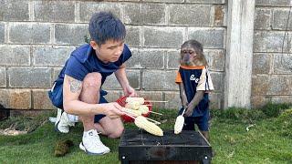 Yoyo Jr is happy to enjoy grilled corn with dad