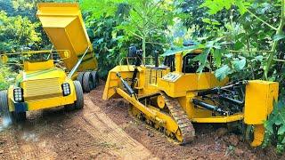 dozer and dump truck | caterpillar d11, volvo a30g