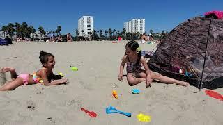 Kids are playing on the beach with sand and having fun