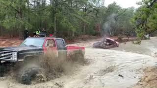 Crew Cab Squarebody Chevy on 44” Boggers Yanking Someone Out