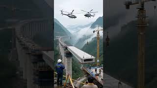 The large section of the bridge is being assembled with the help of two helicopters. #dronehub