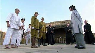 As the Japanese army executes prisoners, a Kung Fu girl jumps down from 100 meters above to rescue