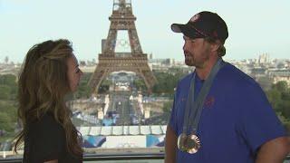 Tram Mai talks with silver-medal archer Brady Ellison