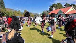 Blairgowrie Pipe Band playing Drunken Piper outside Pavilion during 2024 Braemar Gathering Scotland