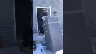 1 MAN MOVING A 750LBS GUN SAFE INTO A BASEMENT