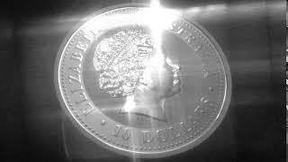 4k Close Up Silver Coin With Cross Glare Shine